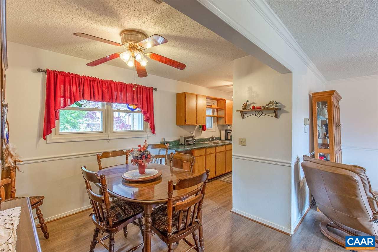 52 Morning Glory Road Ruckersville, VA 22968 - Photo 24 of 38 a dining room with furniture a chandelier and window
