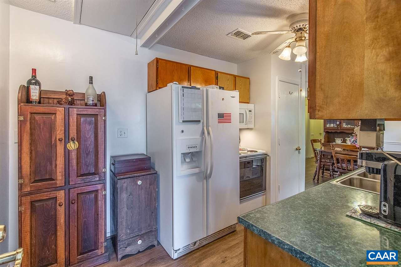 52 Morning Glory Road Ruckersville, VA 22968 - Photo 28 of 38 a kitchen with stainless steel appliances granite countertop a refrigerator and a stove top oven
