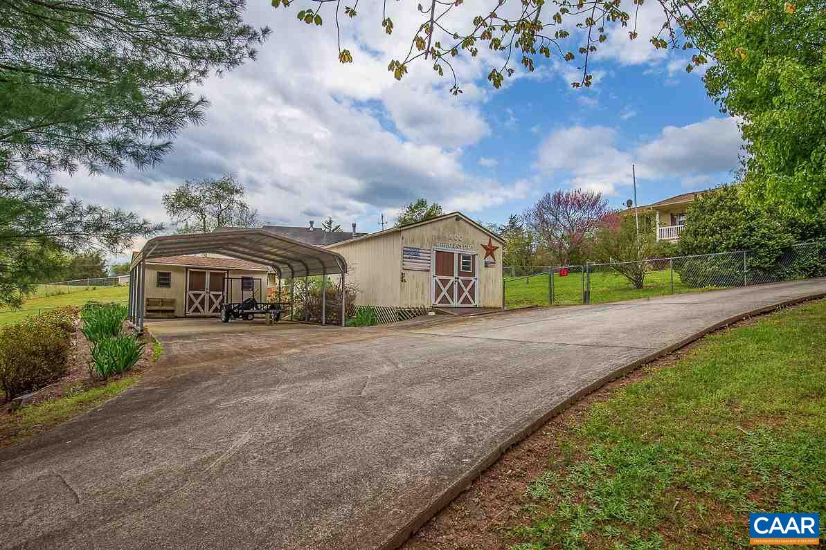 52 Morning Glory Road Ruckersville, VA 22968 - Photo 3 of 38 a front view of a house with garden