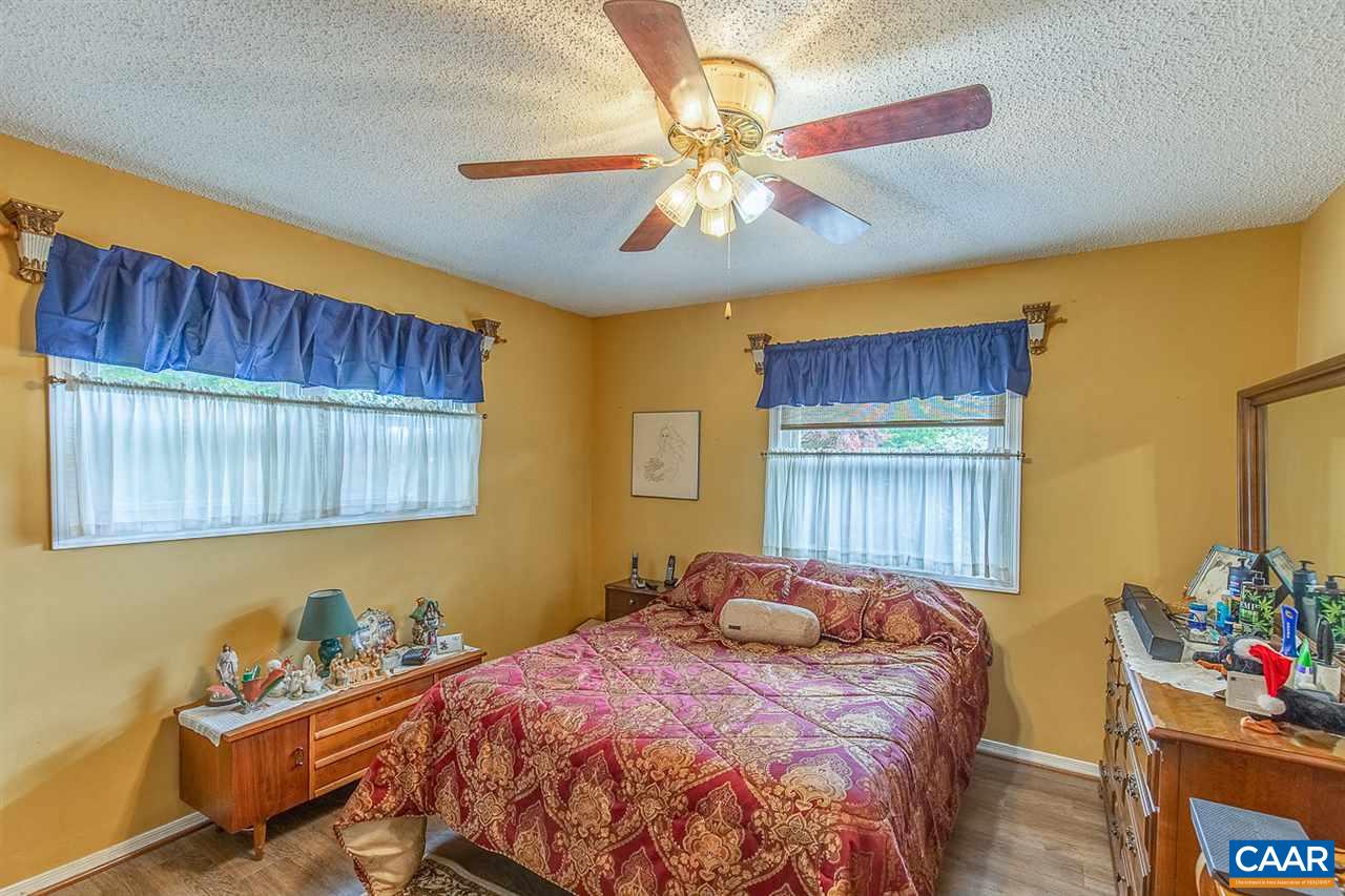 52 Morning Glory Road Ruckersville, VA 22968 - Photo 32 of 38 a bedroom with a bed and a window