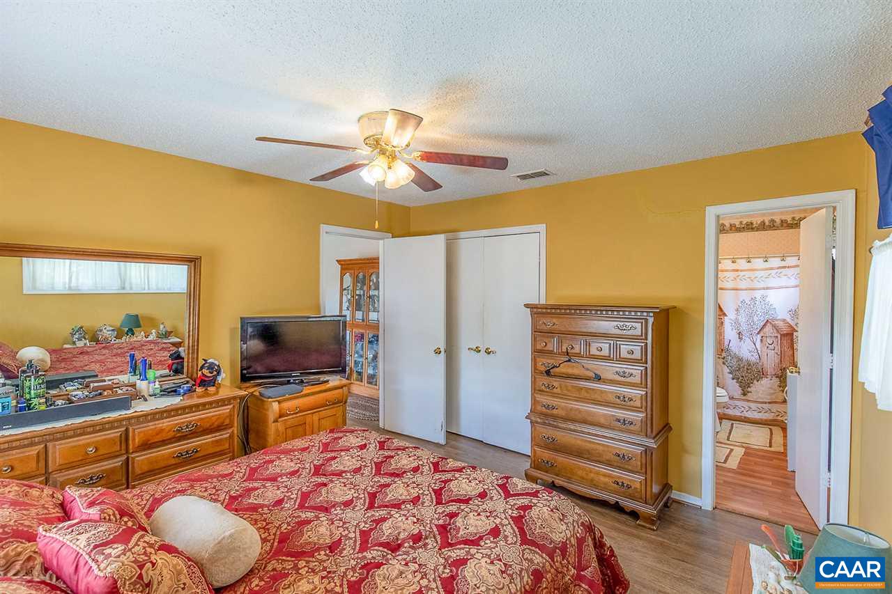 52 Morning Glory Road Ruckersville, VA 22968 - Photo 33 of 38 a bedroom with a bed and a flat screen tv