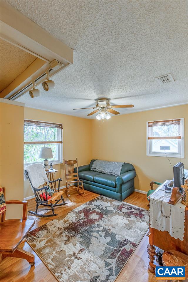 52 Morning Glory Road Ruckersville, VA 22968 - Photo 36 of 38 a living room with furniture a rug and a window
