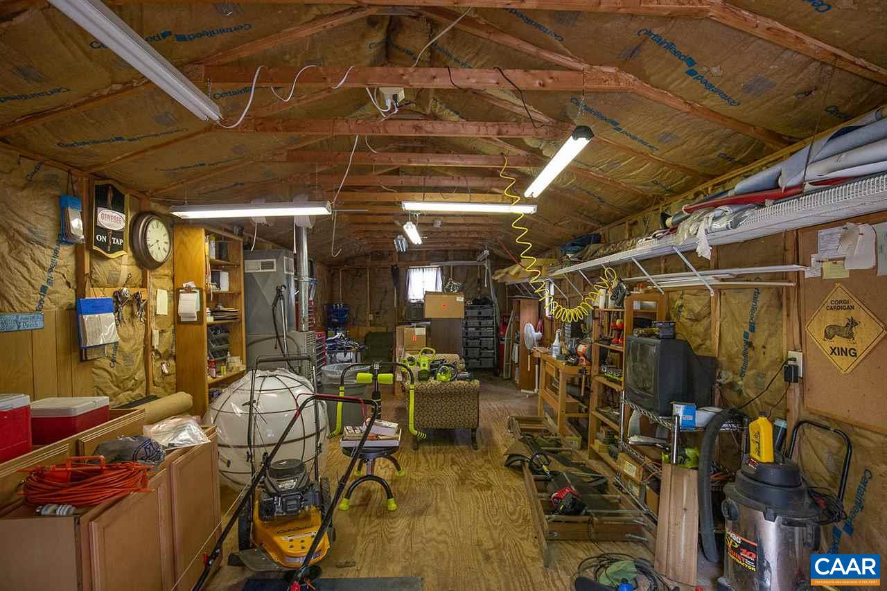 52 Morning Glory Road Ruckersville, VA 22968 - Photo 5 of 38 a view of a storage room with racks on the wall