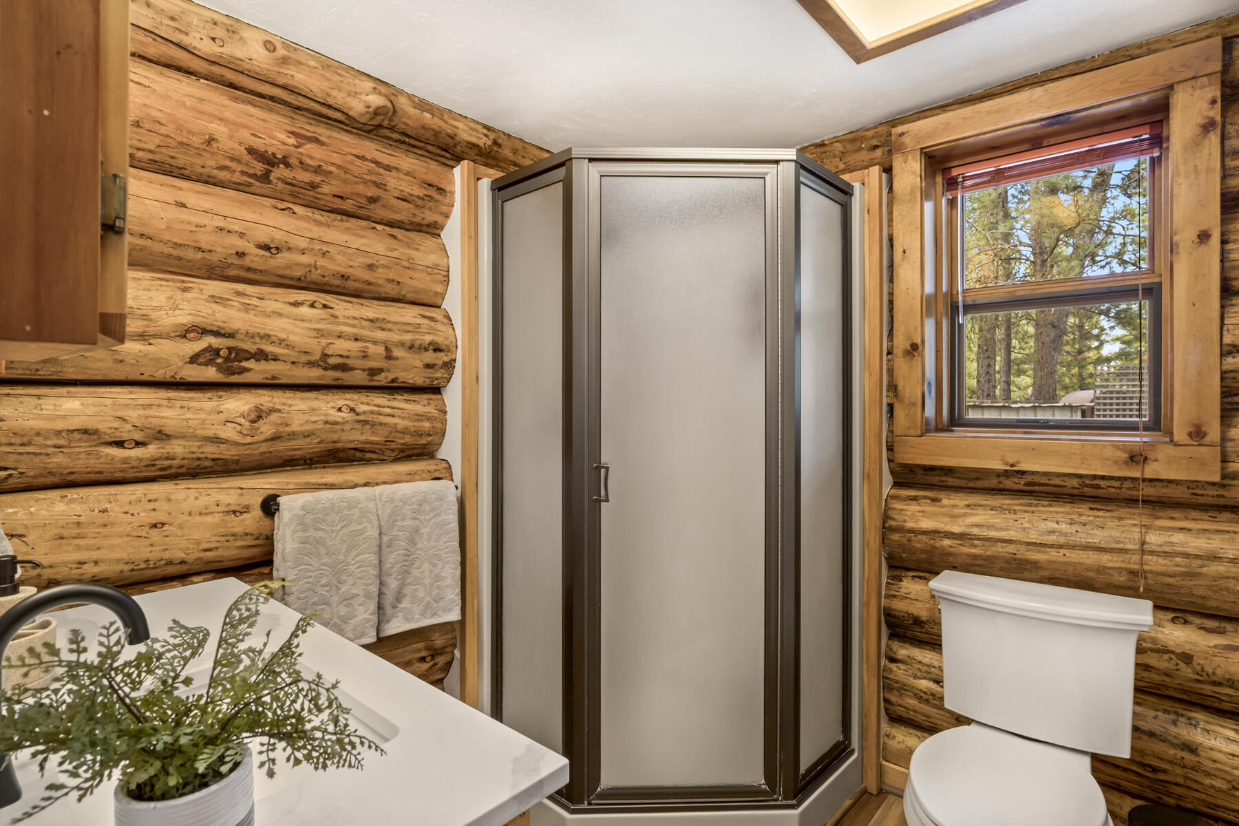 17026 Sharp Drive Bend, OR 97707 - Photo 36 of 72 a bathroom with a toilet and a shower curtain