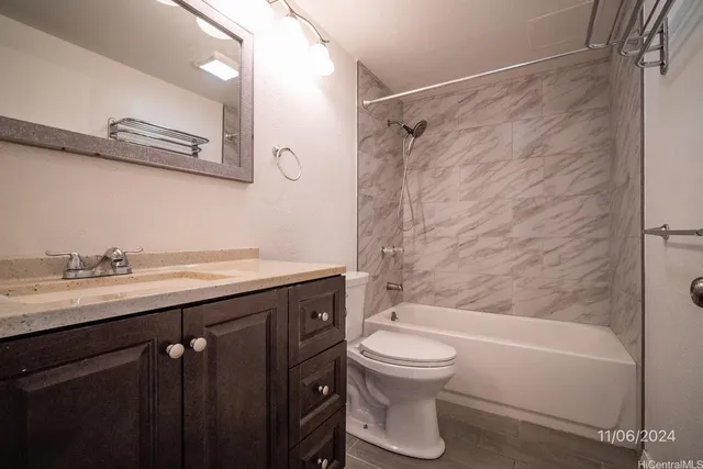 a bathroom with a sink a toilet and a bathtub