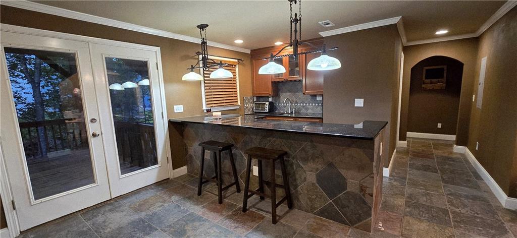 409 Misty Ridge Way Woodstock, GA 30189 - Photo 15 of 20 a view of a kitchen with a table and refrigerator