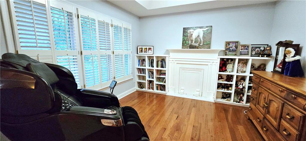 409 Misty Ridge Way Woodstock, GA 30189 - Photo 19 of 20 a view of a bedroom with furniture and window