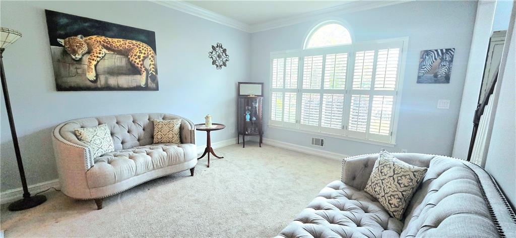409 Misty Ridge Way Woodstock, GA 30189 - Photo 20 of 20 a living room with furniture and a large window