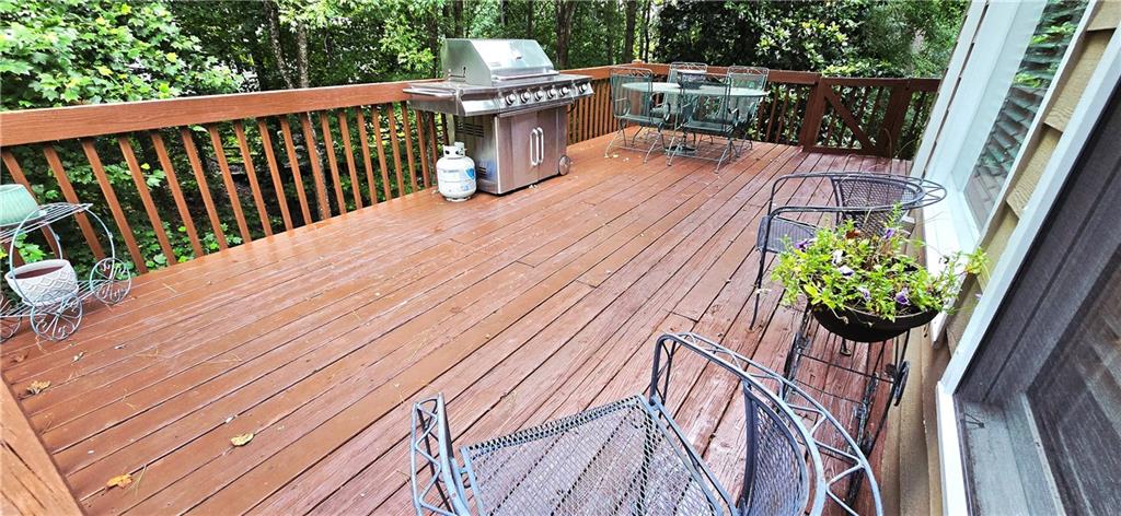 409 Misty Ridge Way Woodstock, GA 30189 - Photo 9 of 20 a balcony with wooden floor