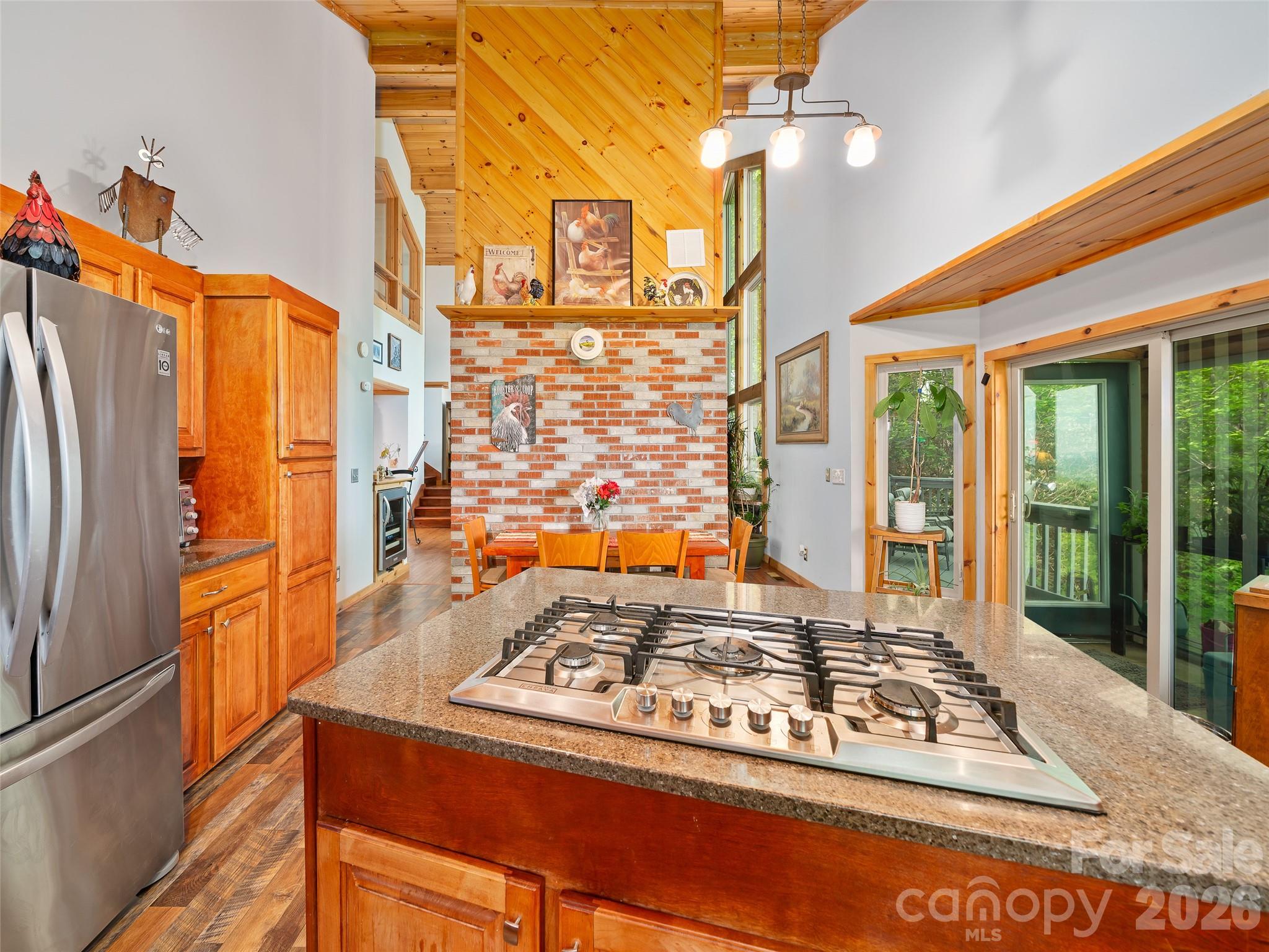 228 Continental Divide Road Spruce Pine, NC 28777 - Photo 11 of 48 a view of a kitchen with a stove and a refrigerator