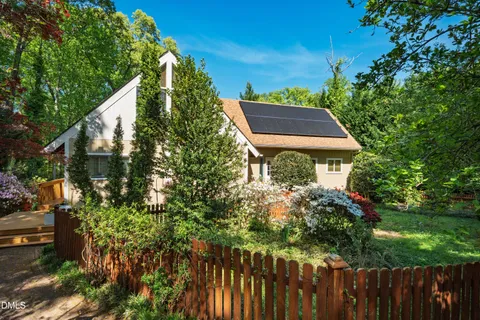 a backyard of a house with lots of green space