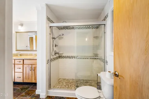 a view of a garden with a building in the background