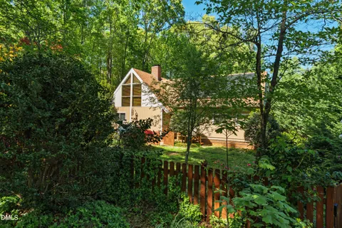a backyard of a house with lots of green space