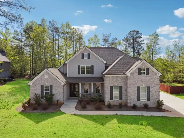front view of a house with a yard