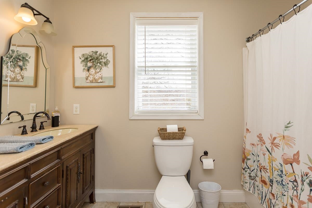 442 First Street Shenandoah, VA 22849 - Photo 35 of 75 a bathroom with a toilet sink and mirror