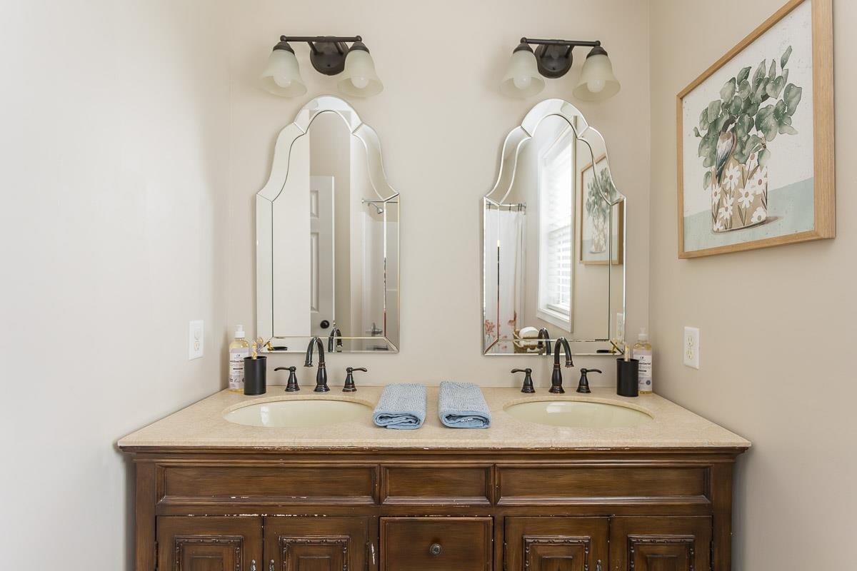 442 First Street Shenandoah, VA 22849 - Photo 36 of 75 a bathroom with double vanity sinks and a mirror