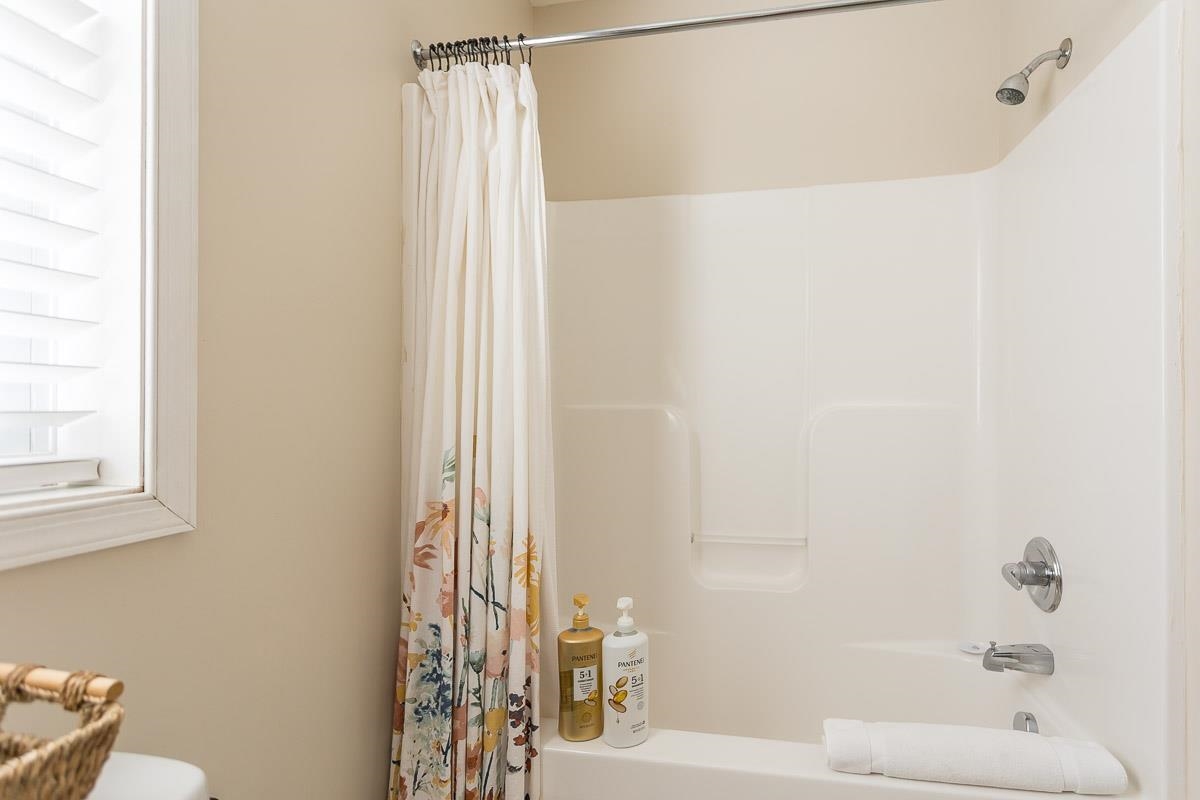 442 First Street Shenandoah, VA 22849 - Photo 37 of 75 a bathroom with a shower curtain and a window