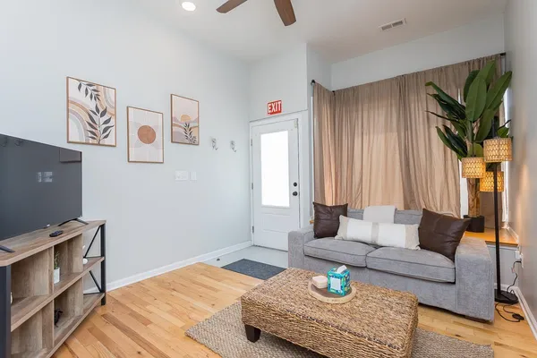 a bed room with a bed and a television