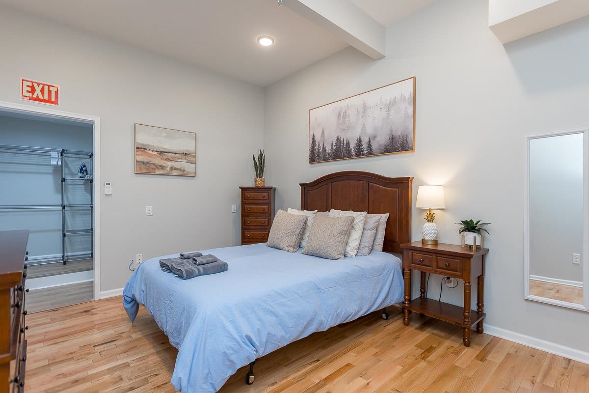 442 First Street Shenandoah, VA 22849 - Photo 54 of 75 a bedroom with a bed and wooden floor