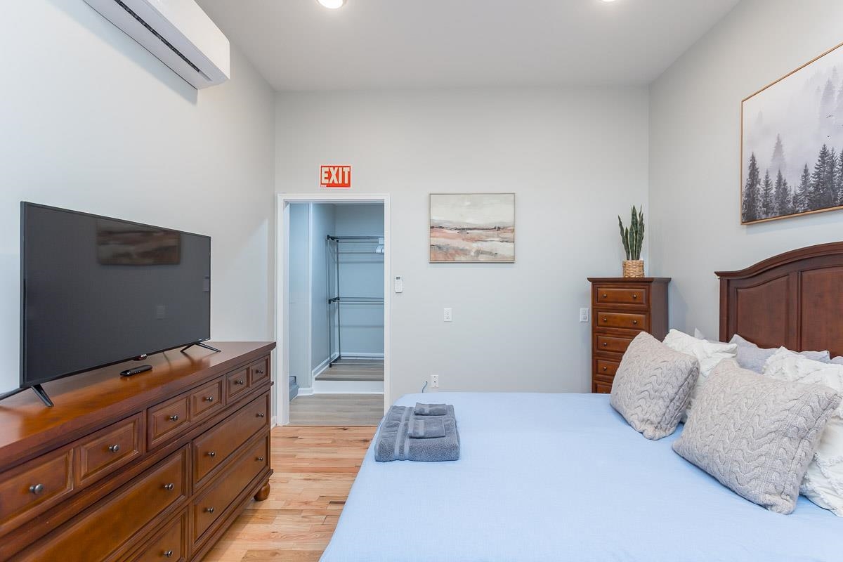 442 First Street Shenandoah, VA 22849 - Photo 55 of 75 a bedroom with a bed and a flat screen tv