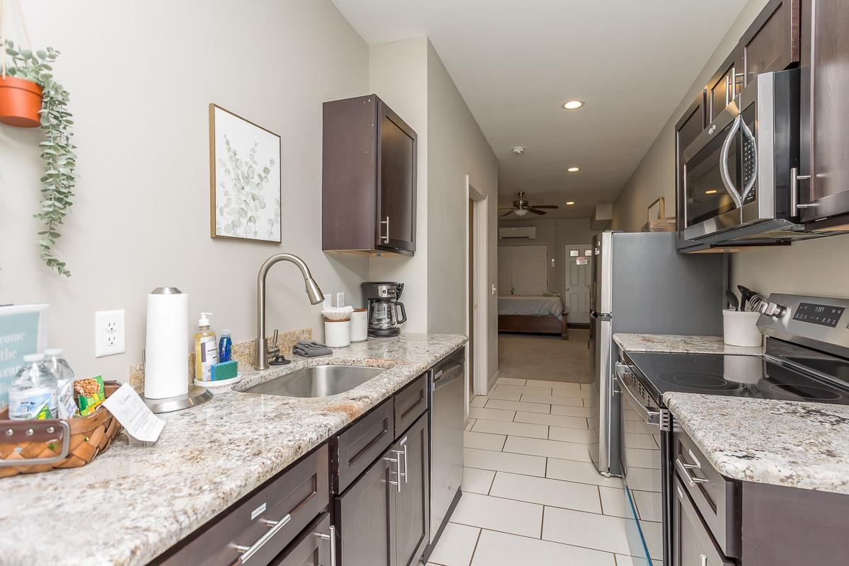 442 First Street Shenandoah, VA 22849 - Photo 58 of 75 a kitchen with stainless steel appliances granite countertop a sink stove and cabinets
