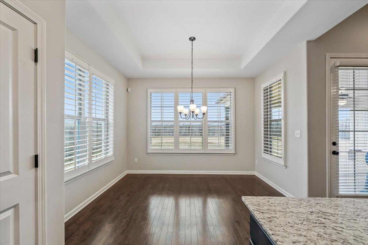 55 Cypress Point Road Oakland, TN 38060 - Photo 11 of 32 a view of an empty room with wooden floor and a window