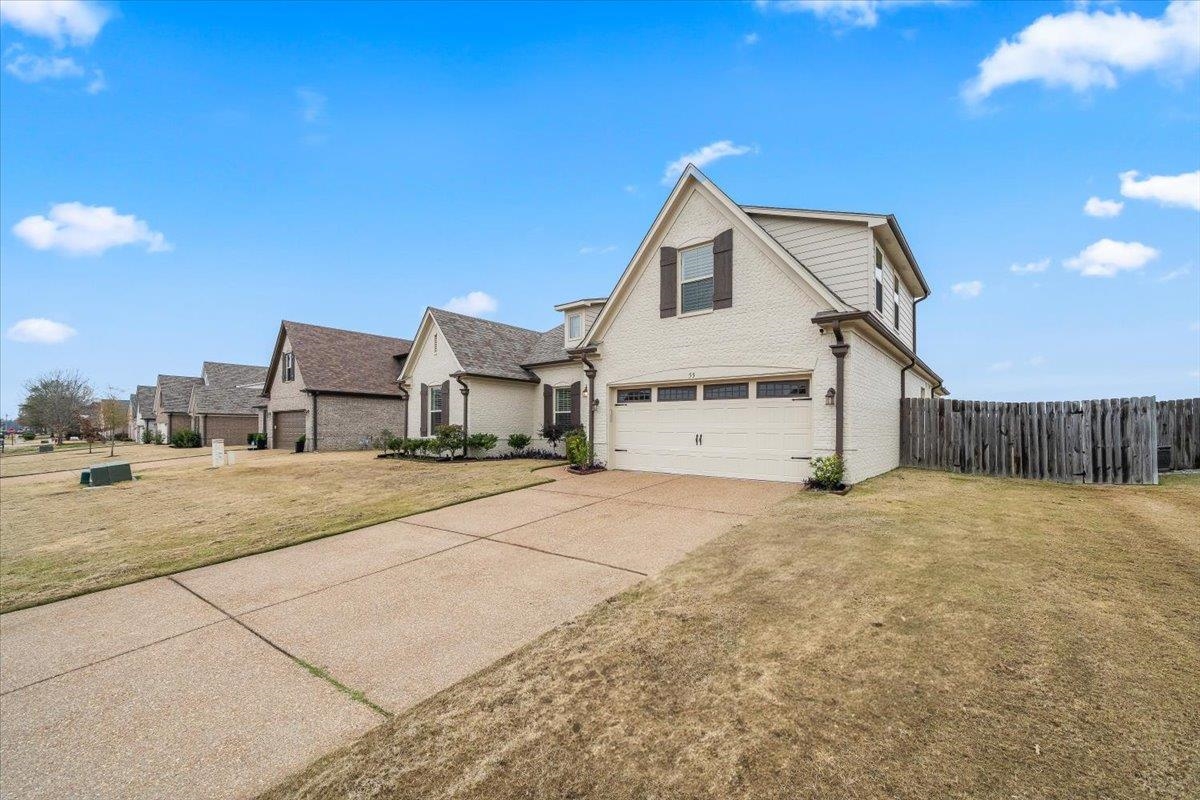 55 Cypress Point Road Oakland, TN 38060 - Photo 2 of 32 a view of a house with a yard