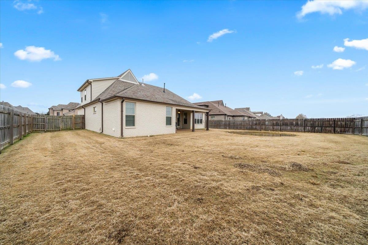 55 Cypress Point Road Oakland, TN 38060 - Photo 27 of 32 a house with river in front of it