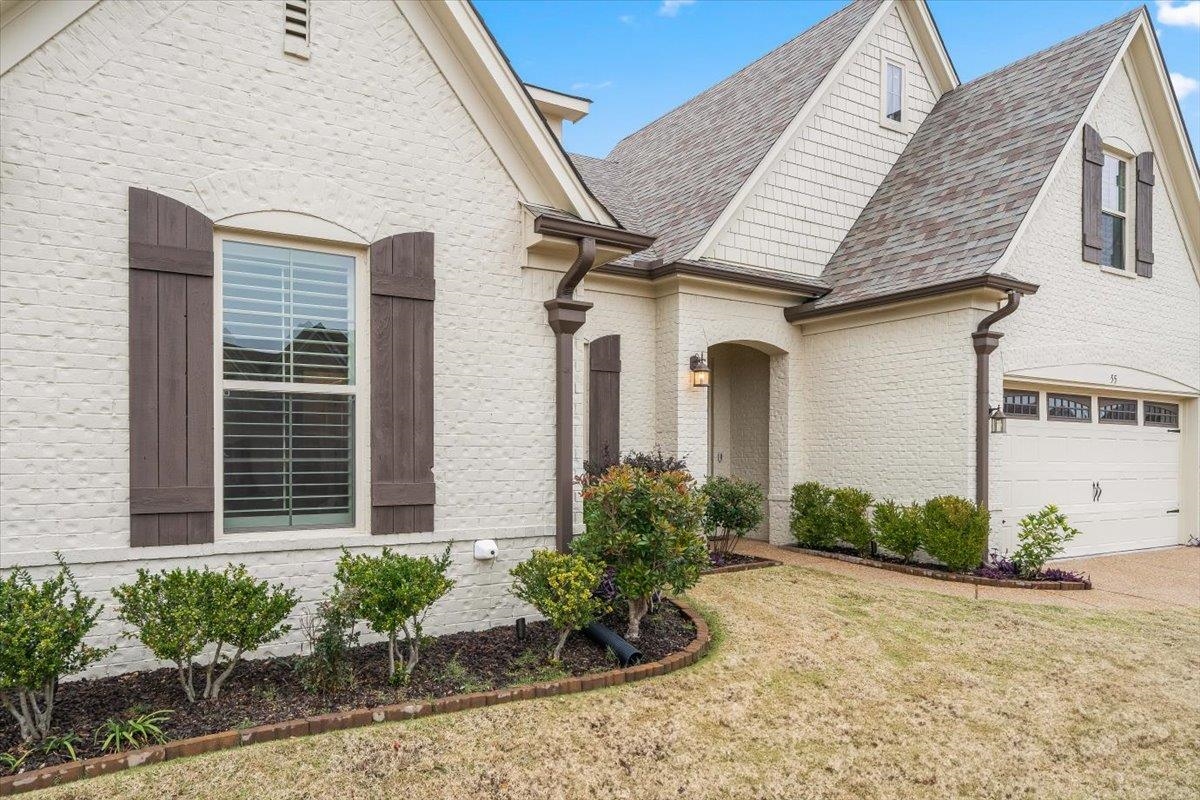 55 Cypress Point Road Oakland, TN 38060 - Photo 3 of 32 a front view of a house with garden