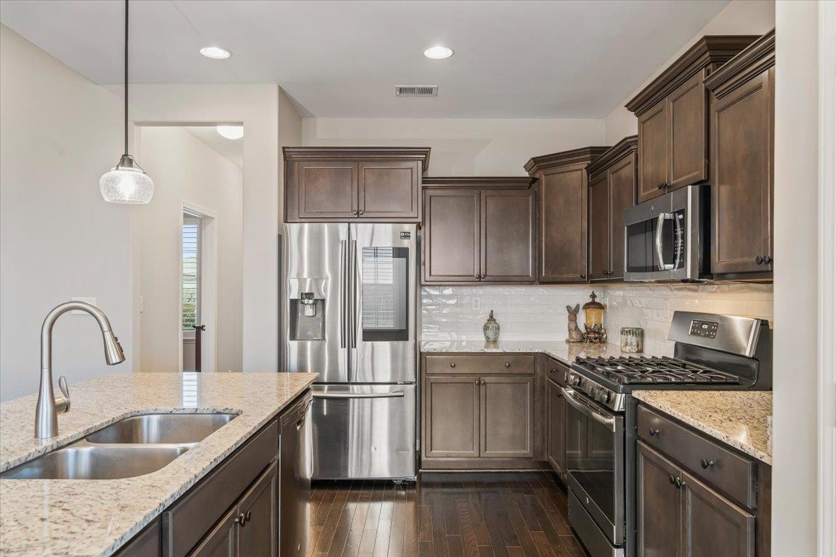 55 Cypress Point Road Oakland, TN 38060 - Photo 8 of 32 a kitchen with a sink appliances and cabinets