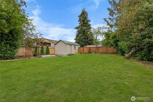 a view of a backyard with a small cabin