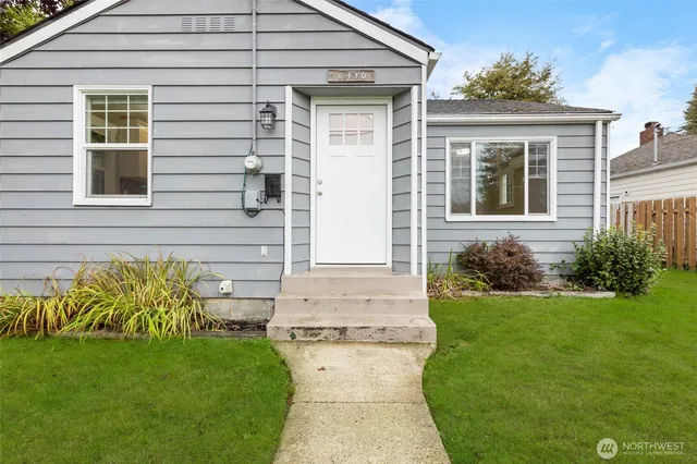 a front view of a house with garden