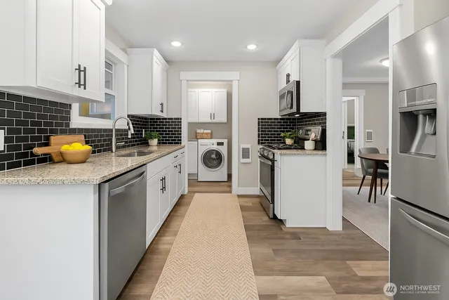 a kitchen with a sink a counter and cabinets