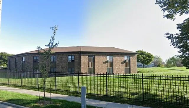 a view of a house with a big yard and plants