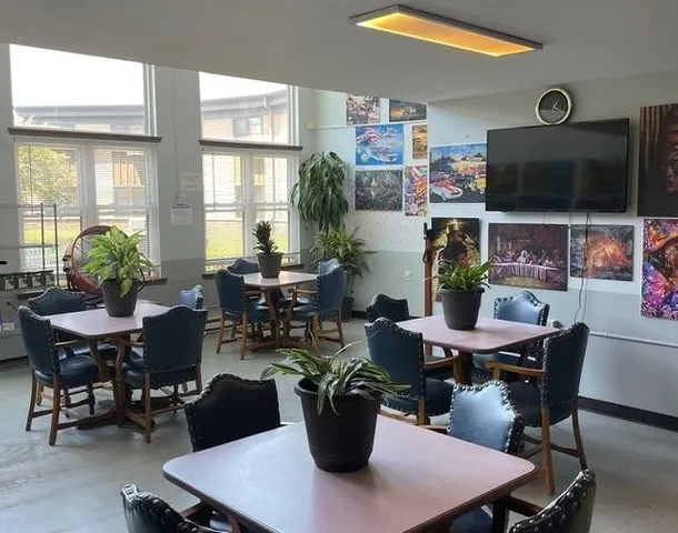 a view of a room with furniture and window