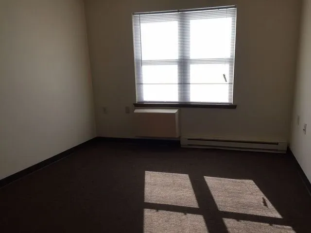 a kitchen with granite countertop a stove and a refrigerator
