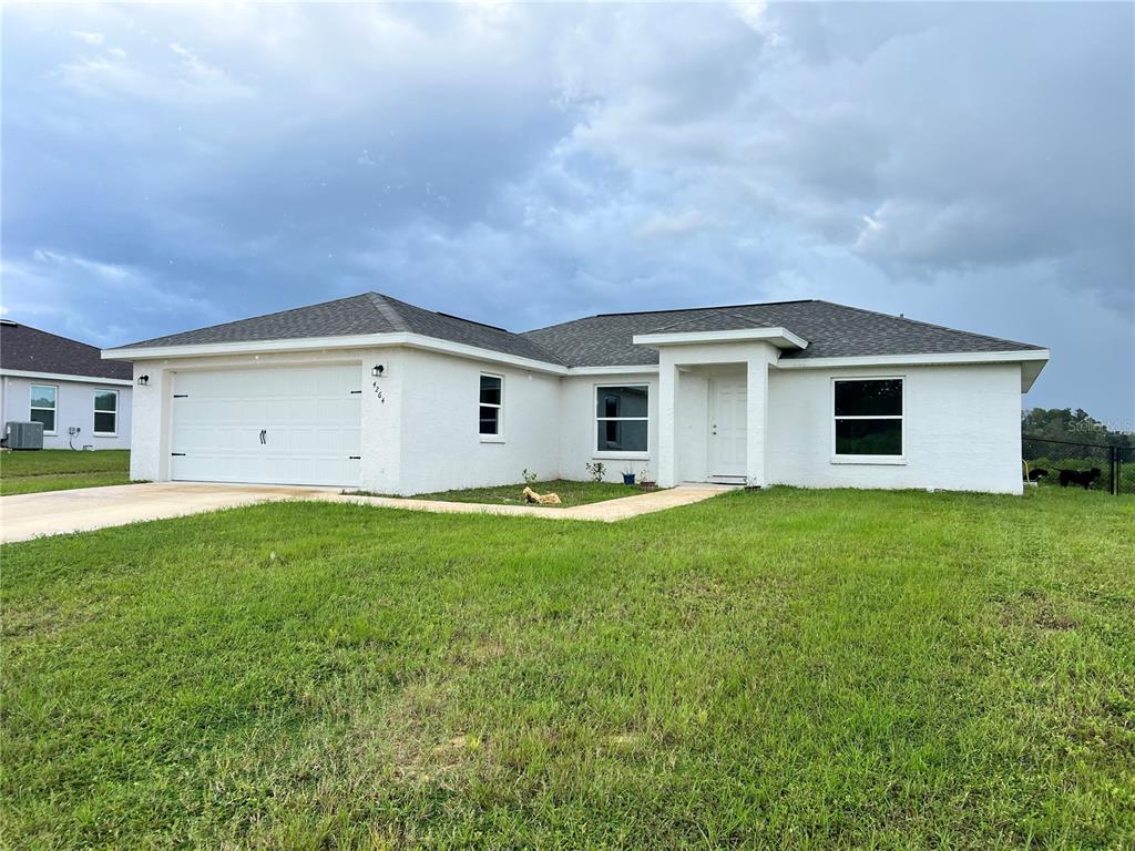 4264 East Taper Street Inverness, FL 34453 - Photo 1 of 29 a view of a house with backyard