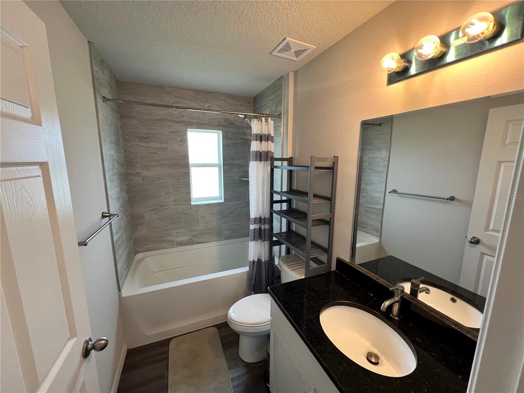 4264 East Taper Street Inverness, FL 34453 - Photo 12 of 29 a bathroom with a sink toilet tub and shower