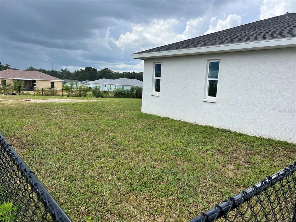 4264 East Taper Street Inverness, FL 34453 - Photo 14 of 29 a view of a house with a yard