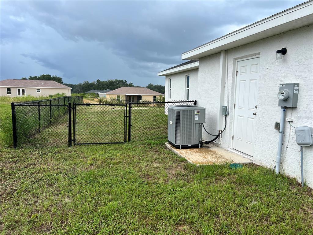 4264 East Taper Street Inverness, FL 34453 - Photo 17 of 29 a view of a backyard with table and chairs
