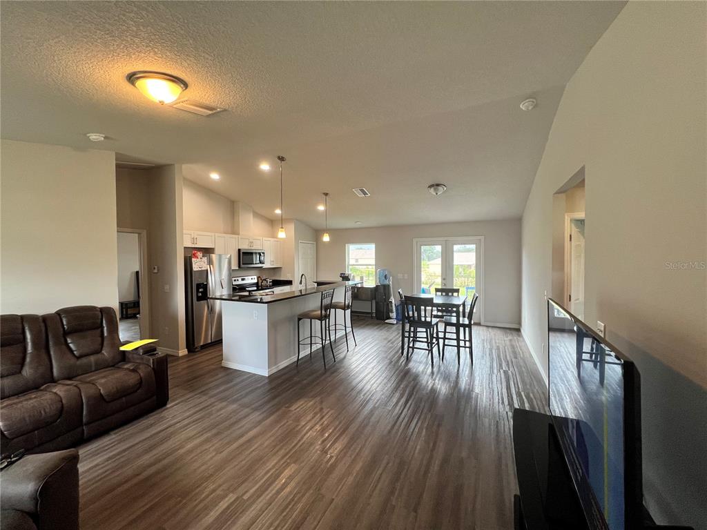 4264 East Taper Street Inverness, FL 34453 - Photo 2 of 29 a living room with furniture and kitchen view