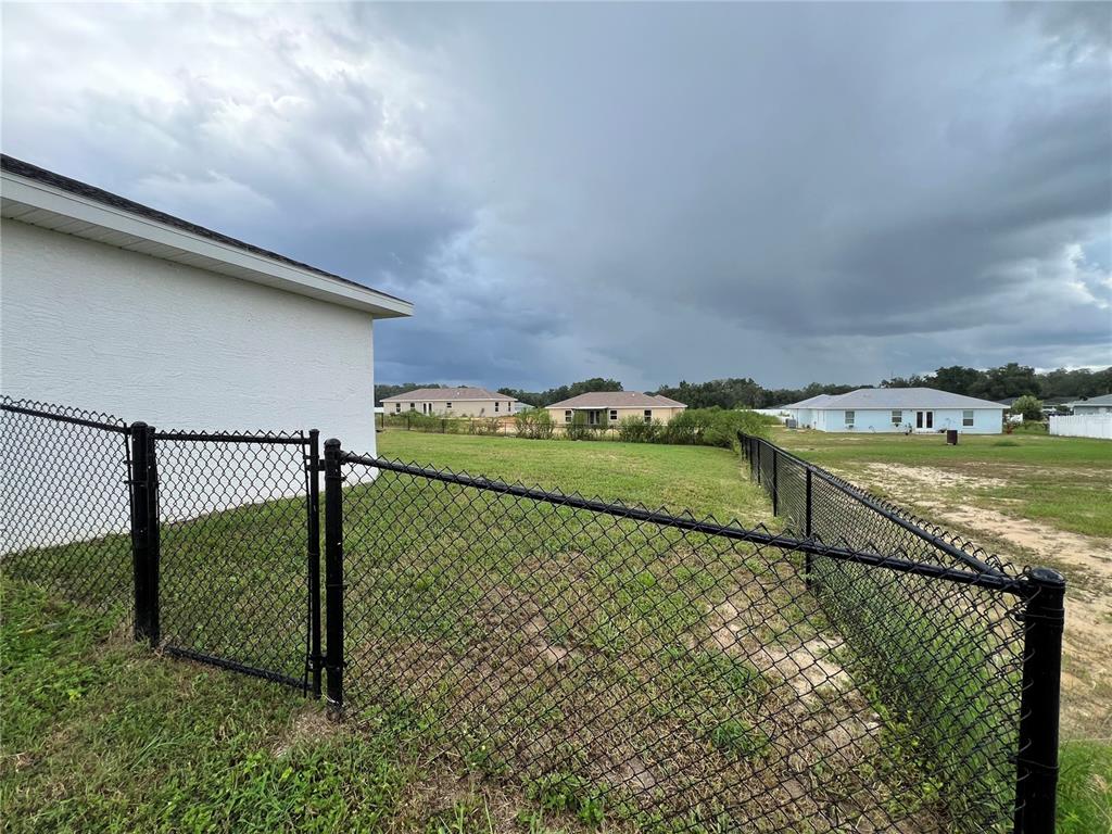 4264 East Taper Street Inverness, FL 34453 - Photo 22 of 29 a view of a balcony with two chairs