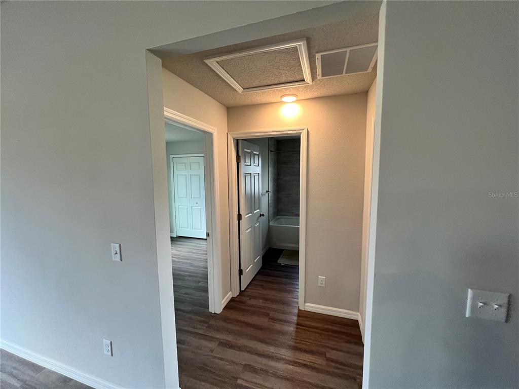 4264 East Taper Street Inverness, FL 34453 - Photo 27 of 29 a view of a hallway with wooden floor