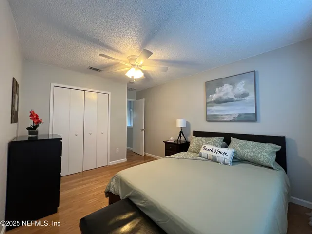 a bedroom with furniture and a bed