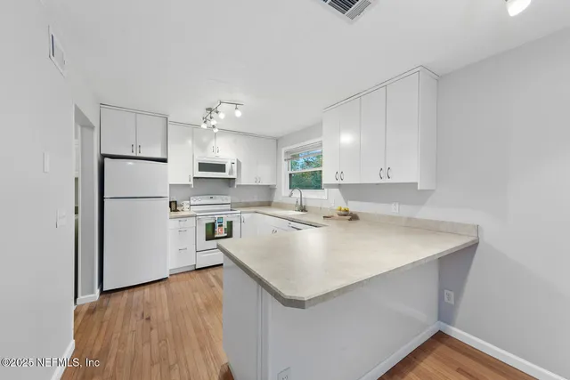 a bathroom with a toilet a sink and a mirror