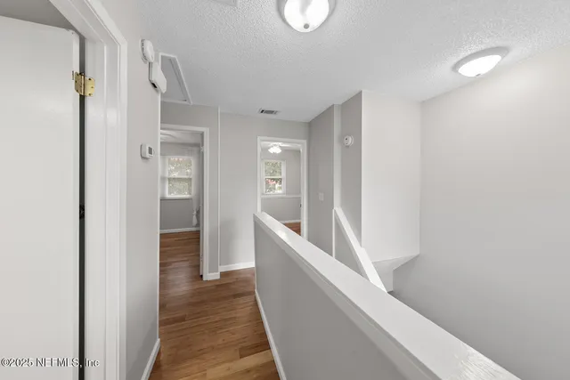 a view of an empty room with a fan