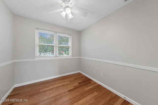 a view of a backyard with a trees