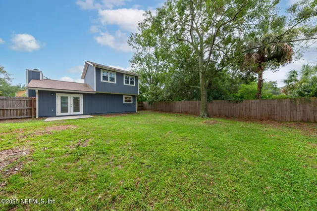 a front view of multi story residential apartment building with swimming pool