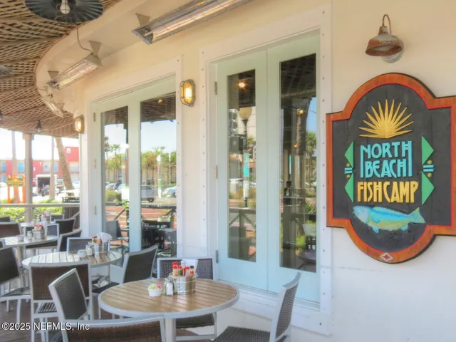 a swimming pool view with a sitting space