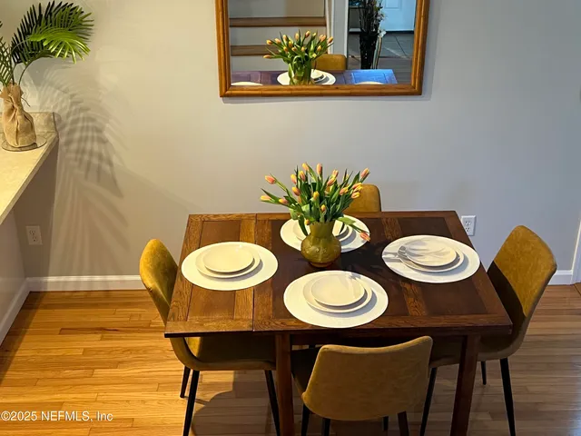 a bathroom with a toilet a sink and a mirror